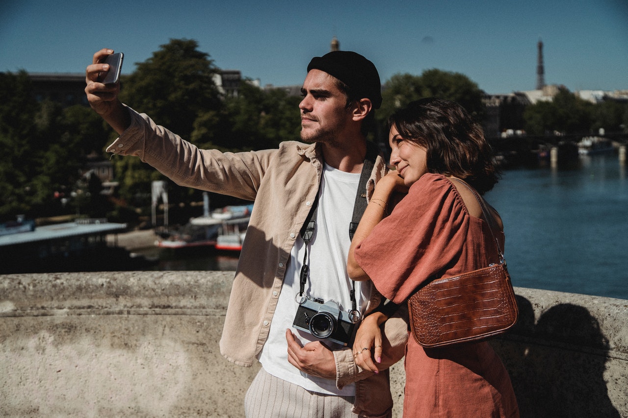 Man and Woman Taking selfies Together