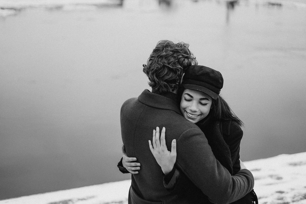 Couple Hugging Each Other near a lake