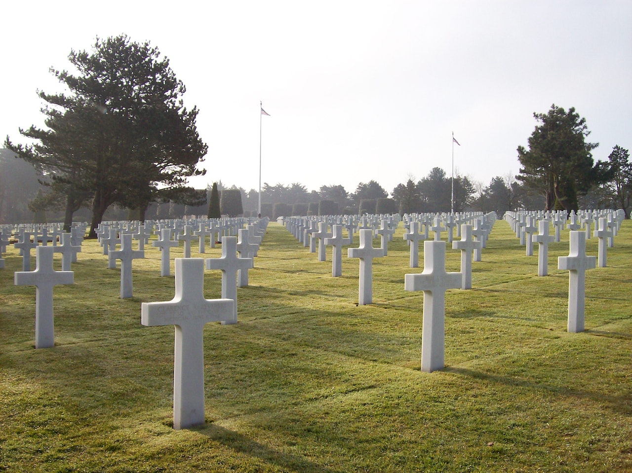 Cemetery Full of White Crosses In Line