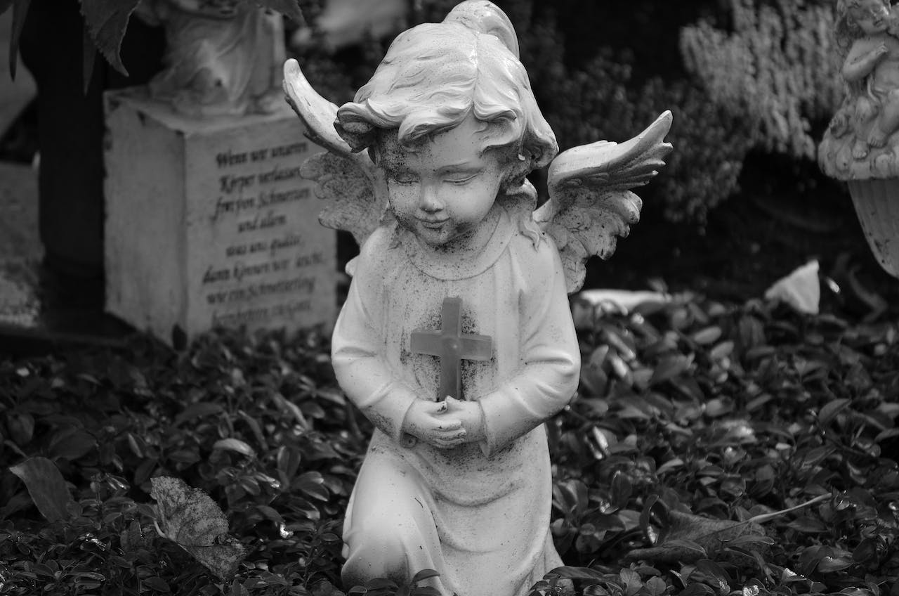 Angel Statue Holding Cross