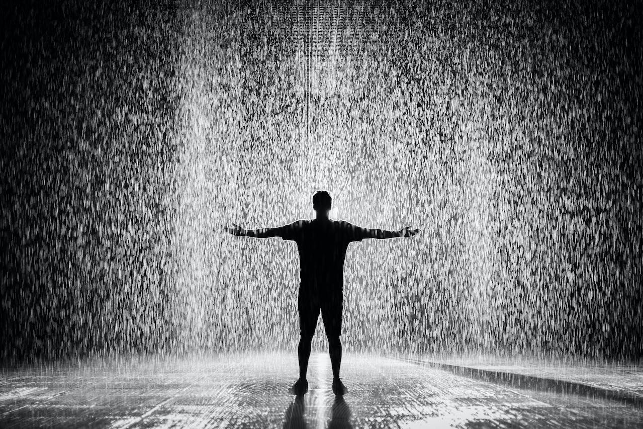 Man Standing Under the Rain